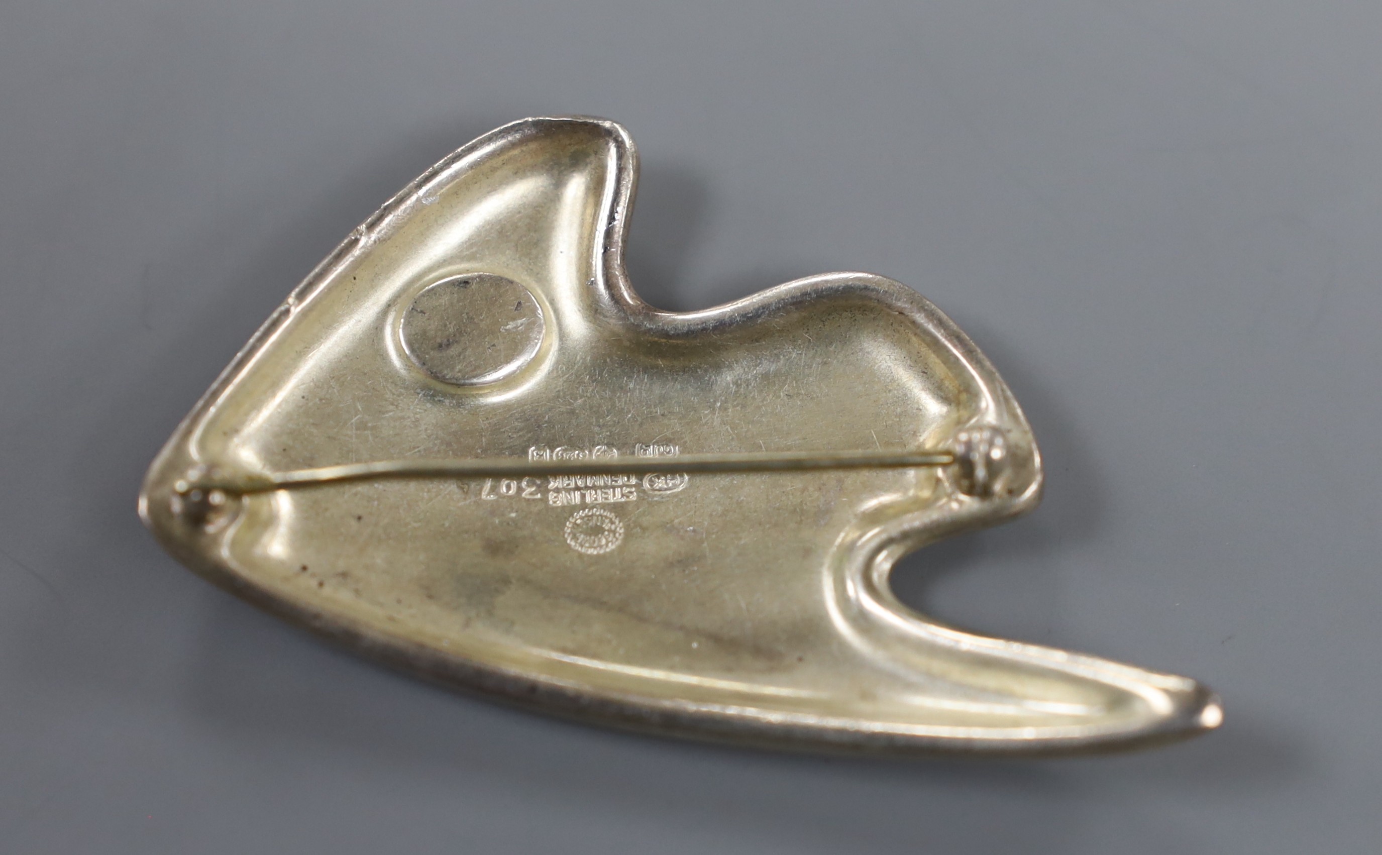 A Georg Jensen 925 sterling and enamel stylised fish brooch, no. 307, 60mm.